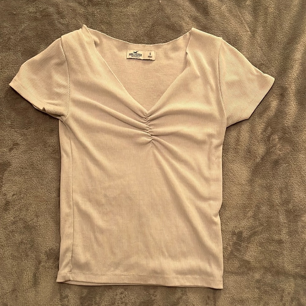 white top with a small rouch in the middle